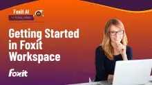 Getting Started in Foxit Workspace- Woman with blonde hair and glasses sitting in front of a computer